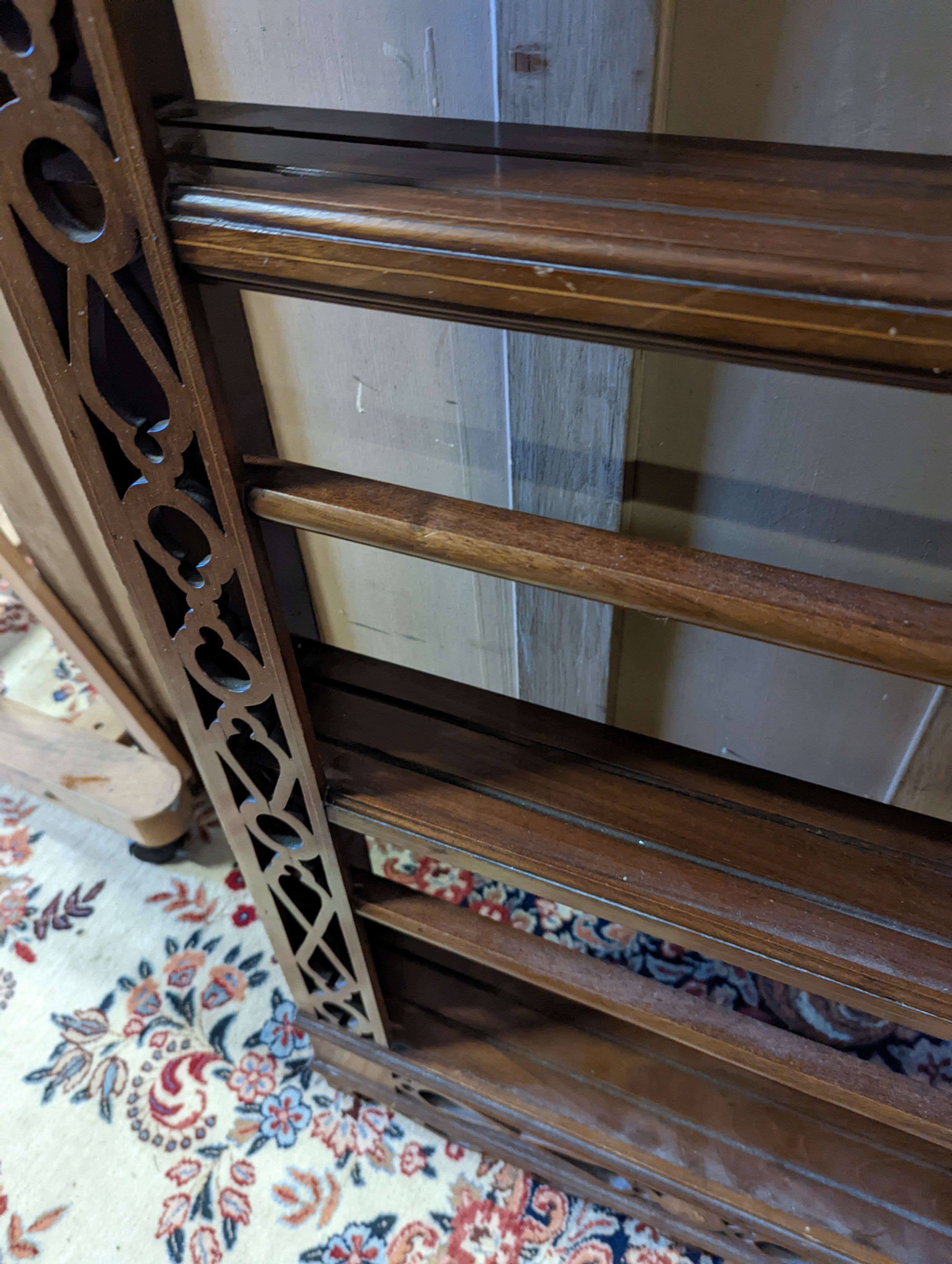 A George III style inlaid mahogany plate rack, width 135cm, depth 17cm, height 119cm